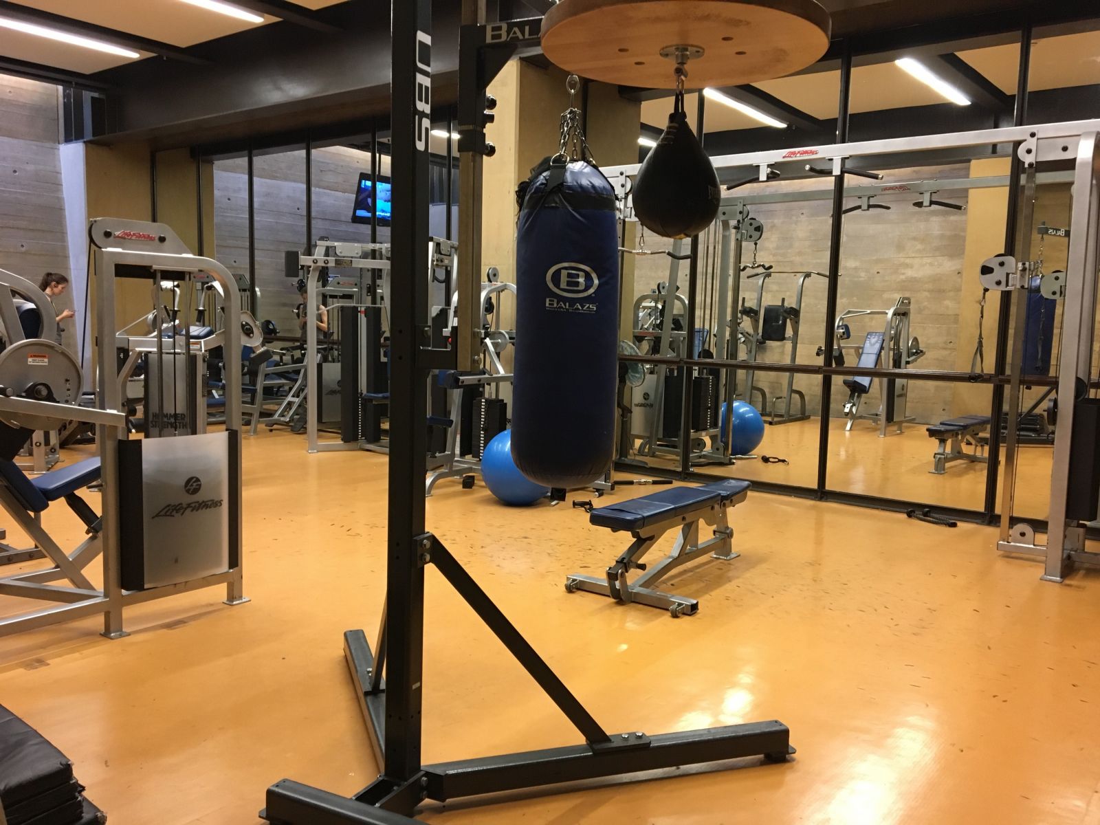 Another angle of the weight room with benches and other workout machine